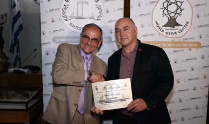 Yannis Prodromou accepting an award on behalf of Yanni's Olive Grove