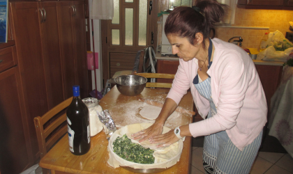 A Cretan mother making spanakopita 
