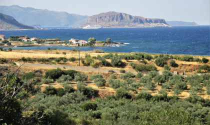 olive trees, blue sea, Monemvasia in the background