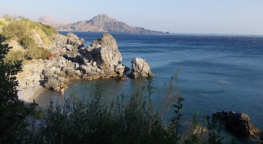 small cove, sea, boulders, hills, and sky between Plakias and Souda Beach