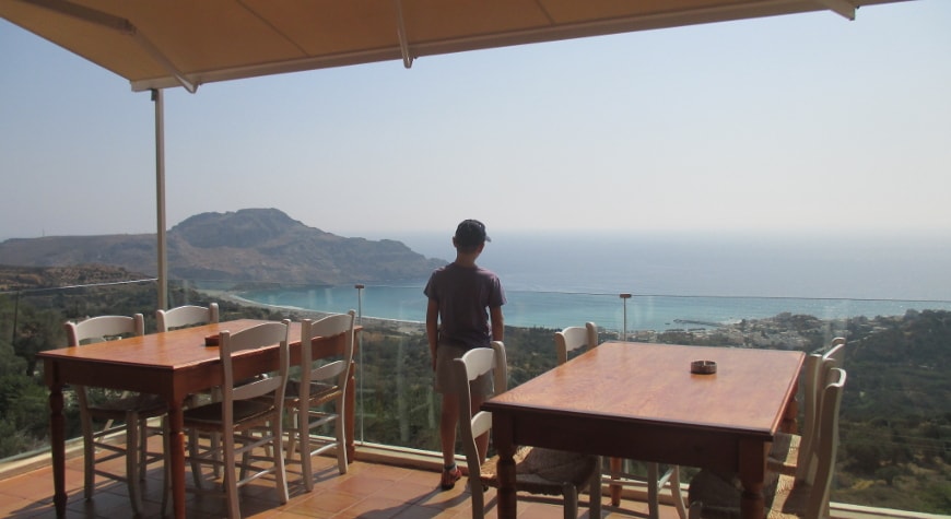 view of sea, hills, and sky from Plateia Taverna in Myrthios, Crete